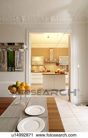 Dining room with view into kitchen View Large Photo Image Stock Image - Dining room with view into kitchen. Fotosearch