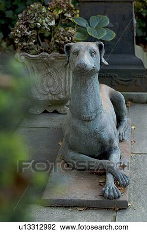 Stock Image - Dog statuette on terrace. Fotosearch