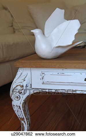 Dove figure on table in living room View Large Photo Image Stock Image - Dove figure on table in living room. Fotosearch