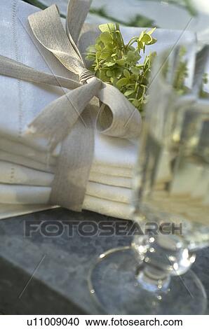 Drink and stack of cloths View Large Photo Image Stock Image - Drink and stack of cloths. Fotosearch