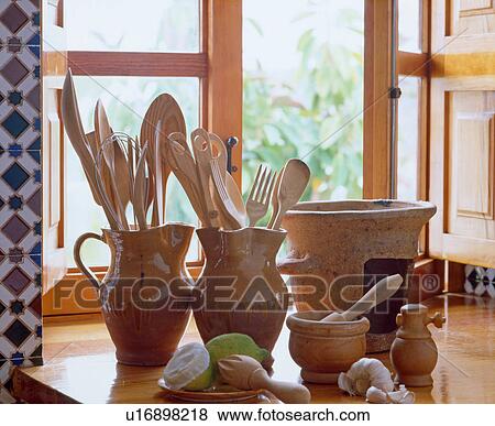 Stock Photo - Earthenware receptacles on kitchen counter. Fotosearch