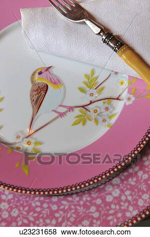 Elegant plate with bird imprint View Large Photo Image Stock Photo - Elegant plate with bird imprint. Fotosearch