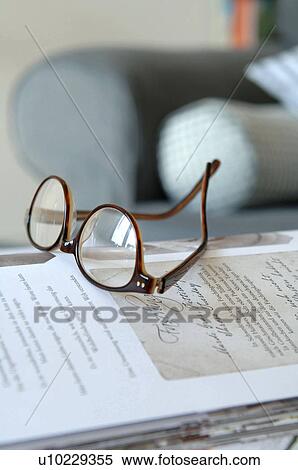 Stock Photography - Eyeglasses on book. Fotosearch