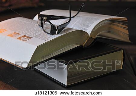 Eyeglasses on book View Large Photo Image Stock Photography - Eyeglasses on book. Fotosearch