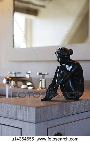 Female figure on kitchen counter View Large Photo Image Stock Photography - Female figure on kitchen counter. Fotosearch