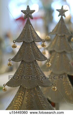 Stock Image - Festive Christmas tree statuettes. Fotosearch