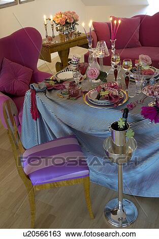 Stock Image - Festive laid table in living room. Fotosearch