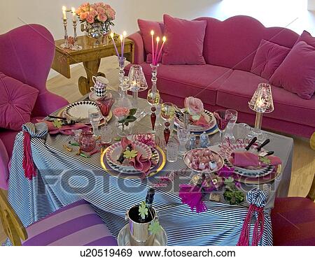 Stock Photo - Festive laid table in living room. Fotosearch
