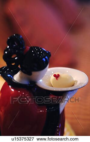 Figurine with confectionary View Large Photo Image Stock Photo - Figurine with confectionary. Fotosearch