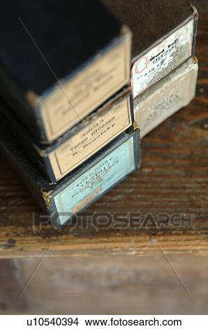 Picture - Five boxes on wooden table. Fotosearch