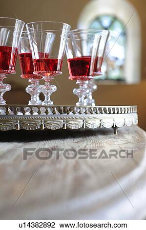 Stock Image - Five glasses of red wine on tray. Fotosearch