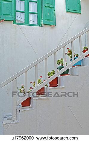 Flower pots standing on stairs View Large Photo Image Stock Image - Flower pots standing on stairs. Fotosearch