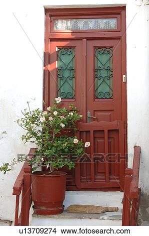 Flower tub in front of house entrance View Large Photo Image Picture - Flower tub in front of house entrance. Fotosearch