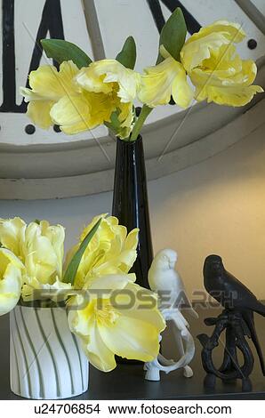 Flowers and bird figurines under wall clock View Large Photo Image Picture - Flowers and bird figurines under wall clock. Fotosearch