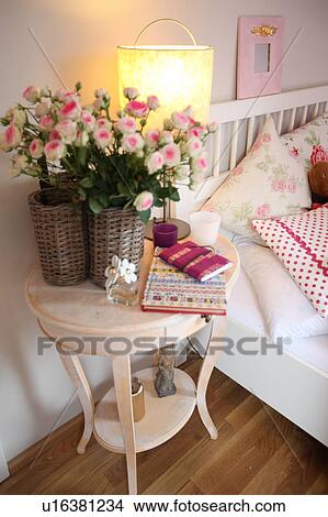 Flowers and standard lamp in bedroom View Large Photo Image Picture - Flowers and standard lamp in bedroom. Fotosearch