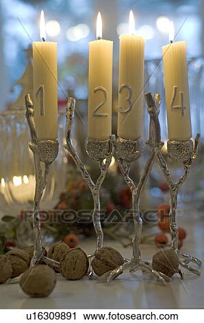 Four burning candles and walnuts View Large Photo Image Stock Image - Four burning candles and walnuts. Fotosearch