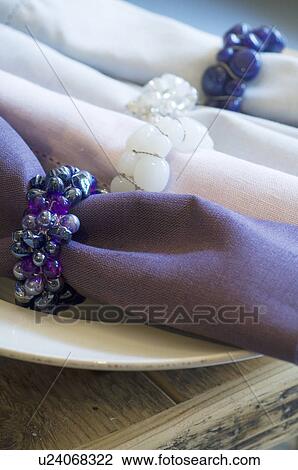 Four napkins with rings on plate View Large Photo Image Stock Image - Four napkins with rings on plate. Fotosearch