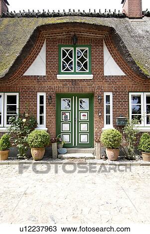 Stock Image - Front door of a country house. Fotosearch