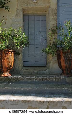 Picture - Front door with flower tubs. Fotosearch