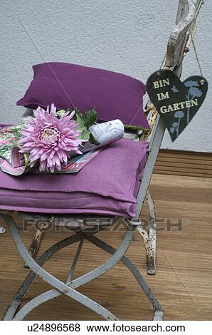 Garden chair with flower and ornate heart View Large Photo Image Stock Photo - Garden chair with flower and ornate heart. Fotosearch