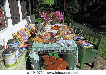 Garden table and bench with cushions View Large Photo Image Picture - Garden table and bench with cushions. Fotosearch