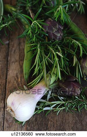 Stock Image - Garlic, rosemary, beans and artichoke. Fotosearch