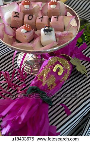 Stock Photography - Garnish on confectionary at New Years Eve and Christmas cracker. Fotosearch