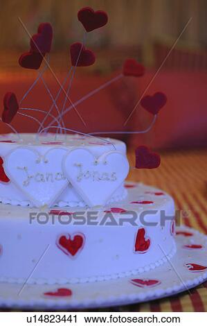 Stock Image - Gateau with name plates and hearts. Fotosearch