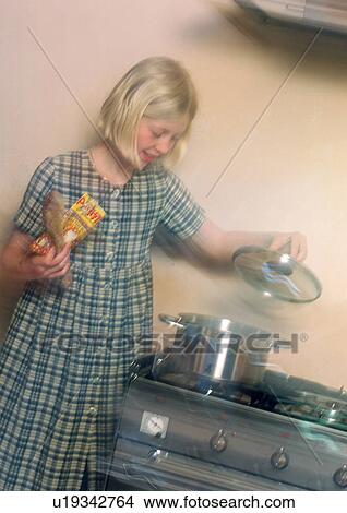 Girl cooking in kitchen View Large Photo Image Picture - Girl cooking in kitchen. Fotosearch