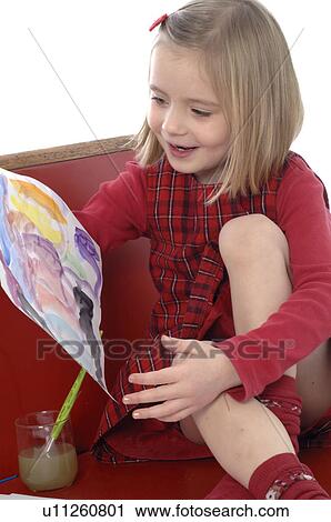 Stock Image - Girl painting picture. Fotosearch