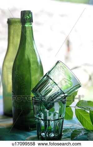 Stock Photo - Glass bottles and drinking glasses. Fotosearch