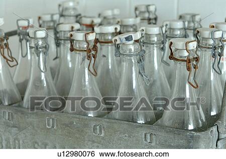 Stock Photograph - Glass bottles with swing tops in a box. Fotosearch