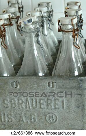 Glass bottles with swing tops in a box View Large Photo Image Stock Photograph - Glass bottles with swing tops in a box. Fotosearch