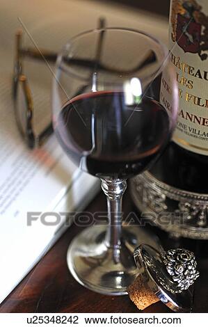 Glass of red wine, book and glasses View Large Photo Image Stock Image - Glass of red wine, book and glasses. Fotosearch