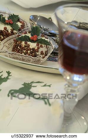 Stock Photo - Glass of red wine on festive table. Fotosearch