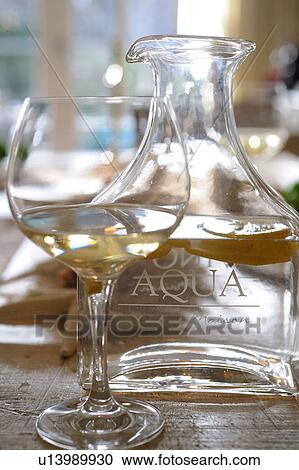 Glass of white wine and carafe with water View Large Photo Image Stock Image - Glass of white wine and carafe with water. Fotosearch