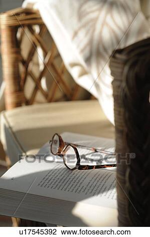 Glasses lying on book View Large Photo Image Stock Image - Glasses lying on book. Fotosearch
