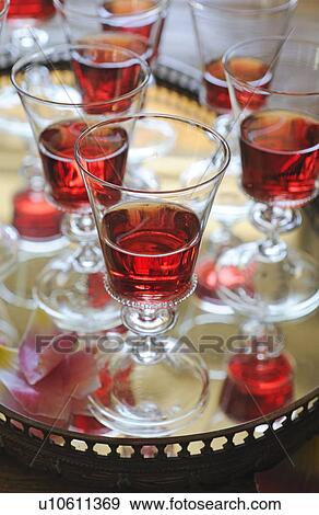 Glasses of red wine on tray View Large Photo Image Stock Photo - Glasses of red wine on tray. Fotosearch