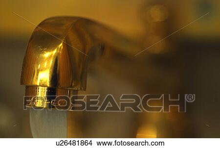 Picture - Golden water tap. Fotosearch