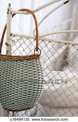 Stock Photography - Handbag hanging at bedpost. Fotosearch