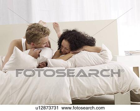 Happy couple in bed View Large Photo Image Stock Image - Happy couple in bed. Fotosearch
