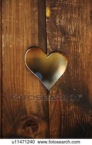 Heart-shaped hole in wooden boards View Large Photo Image Stock Image - Heart-shaped hole in wooden boards. Fotosearch