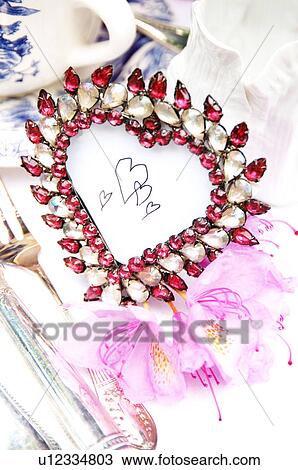 Stock Image - Heart-shaped table decoration. Fotosearch