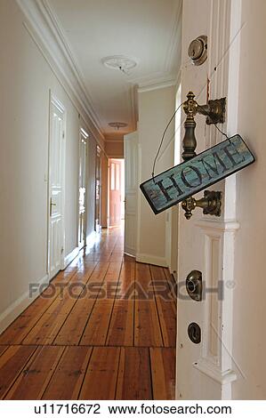 Stock Image - Home sign at door knob. Fotosearch