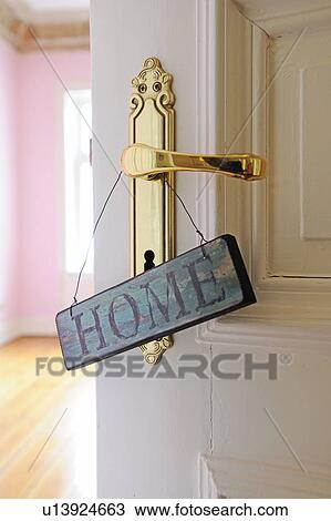 Stock Image - Home sign at door. Fotosearch