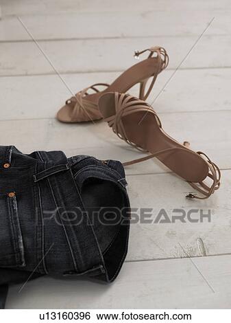 Jeans and womens shoes on wooden floor View Large Photo Image Stock Photograph - Jeans and womens shoes on wooden floor. Fotosearch