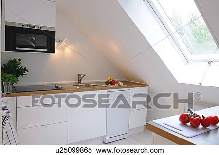Kitchen in an attic flat View Large Photo Image Stock Photography - Kitchen in an attic flat. Fotosearch