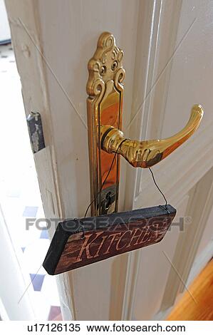 Stock Photography - Kitchen sign at door knob. Fotosearch