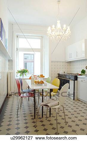 Kitchen with dining area and chandelier View Large Photo Image Stock Photo - Kitchen with dining area and chandelier. Fotosearch