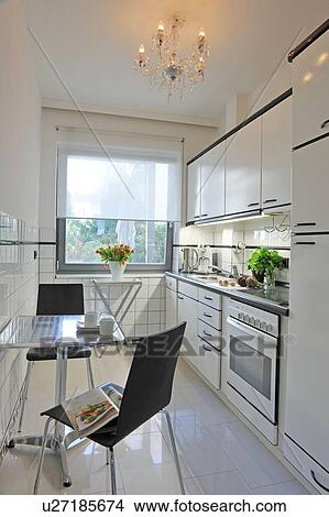 Picture - Kitchen with dining area. Fotosearch